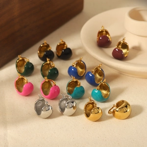 Detailed macro view of retro C-shaped enamel hoop earrings in multiple vibrant colors