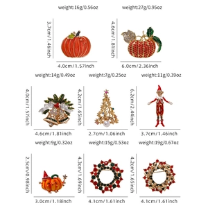Collection of Christmas and Halloween enamel brooches with detailed sizes and weights
