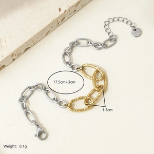 Detail of two-tone stainless steel chunky chain bracelet with hammered gold rings