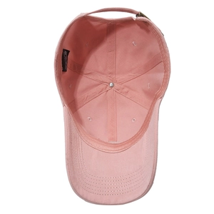 Internal view of pink cotton baseball cap with reinforced seams and metal buckle detail