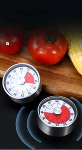Mechanical kitchen timer showing a 5 and 35 minute countdown with a 72dB loud alarm