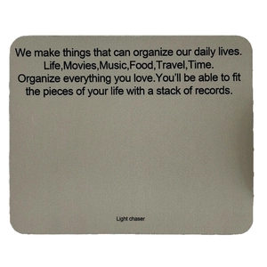 Minimalist grey non-slip desk mat with Light Chaser text and durable rounded corners