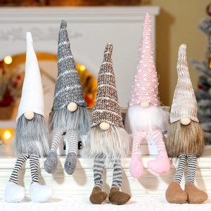 Detailed view of five colorful plush Christmas gnomes with knitted hats for home decor