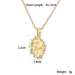 Detail of gold LOVE oval pendant with floral engraving and 45cm chain dimensions