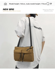 Detail view of khaki nylon messenger bag with functional dual pockets and black drawstrings
