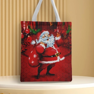 Detail of red Christmas canvas tote bag featuring Santa Claus print and white handles