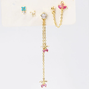 Detail of four-piece gold earring set with zircon flowers, butterflies and tassels