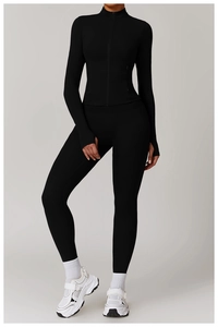 Detail of black slim fit yoga jacket with thumbholes and high waist leggings set