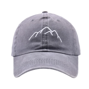 Close-up of white mountain embroidery on gray washed cotton vintage baseball cap