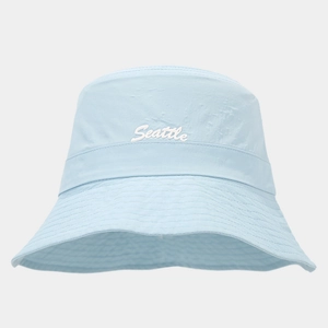 Detailed view of light blue Seattle embroidery on waterproof nylon bucket hat fabric
