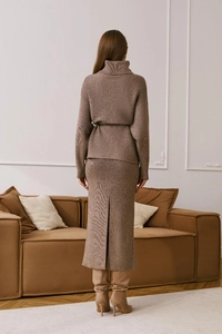Rear view of brown knitted two-piece set with turtleneck top and slit midi skirt