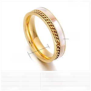 Macro shot of 5mm gold stainless steel ring featuring chain texture and shell inlay