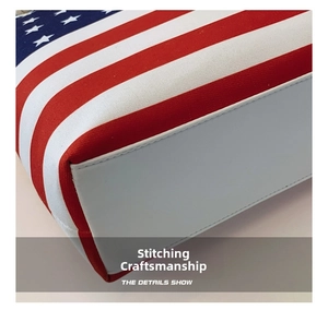 Detailed macro view showing the precise stitching on the canvas US flag tote bag base