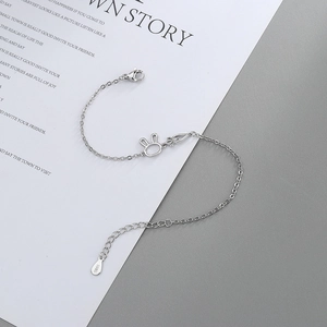 Close-up of S925 sterling silver stamp on rabbit and carrot charm bracelet detail