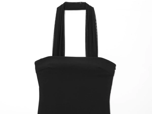 Close-up of black halter dress with sheer mesh pleated straps and side invisible zipper