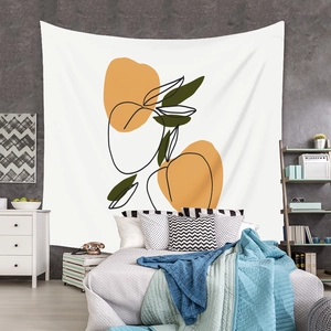 Detail of bohemian tapestry with abstract fruit prints hanging above a bed for wall decor