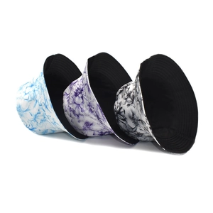 Three floral print bucket hats in blue, purple, and black on a clean white background
