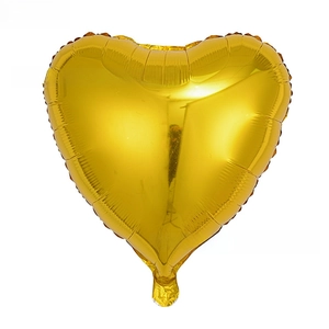 Macro detail of the 18 inch golden heart shaped aluminum foil balloon with metallic finish