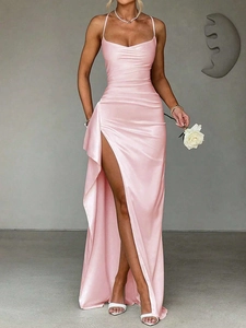Detail of pink satin evening dress with spaghetti straps and high side slit design