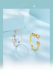 Macro detail of S925 sterling silver playful cat ring with heart-shaped pink zircon