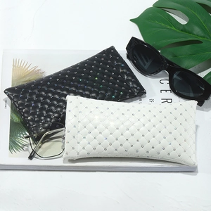 Quilted PU leather sunglasses pouch with sequins and squeeze closure in black and white