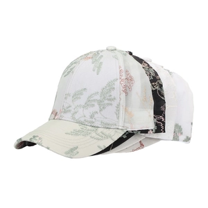 Close-up detail showing a variety of Chinese-style jacquard baseball caps with floral patterns