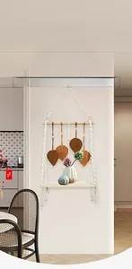 Bohemian wall shelf detail featuring woven leaves and natural wood display board
