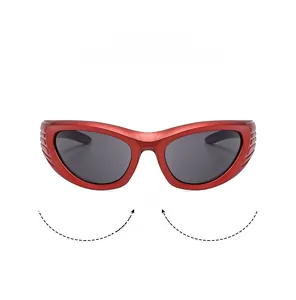 Detail of red Y2K sports sunglasses featuring a streamlined cat-eye frame and dark lenses