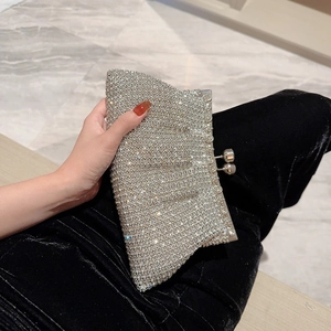 Elegant silver evening clutch bag with sparkling rhinestones and metal ball clasp closure