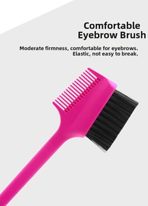 Close-up of dual-ended eyebrow brush with fiber bristles and pink plastic comb
