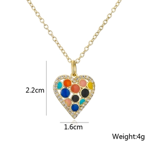 Detail view of 18K gold plated heart pendant with colorful enamel spots and 2.2cm height