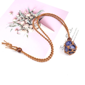 Handmade woven necklace featuring a natural blue stone pendant with brown cord and wood beads