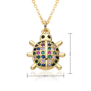 Detailed view of ladybug pendant in gold with colorful zircon stones and 17mm dimensions