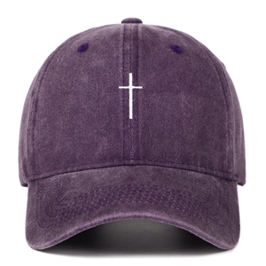 Detail of cross embroidery on vintage washed cotton purple baseball cap