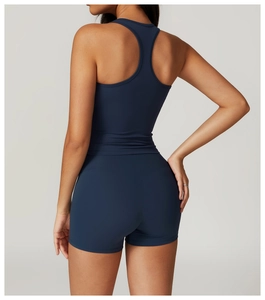 Detail view of navy blue racerback sports bra and high-waisted shorts back construction