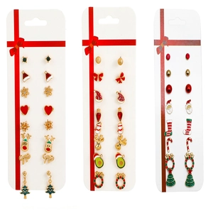 Christmas stud earring set featuring reindeer, candy cane and festive tree motifs