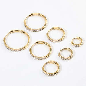Multiple sizes of gold hoop earrings with sparkling cubic zirconia pavé stones