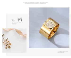 Macro detail of gold wide band ring with shimmering pavé crystal circle ornament