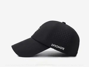 Detail view of black baseball cap with laser-cut side vents and white letter printing