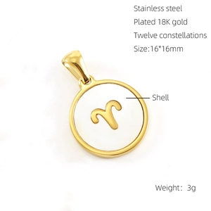 Macro detail of 18K gold plated Aries zodiac pendant with white shell inlay for necklaces