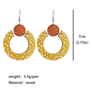 Bohemian wood drop earrings with yellow polka dot circle and geometric brown accents