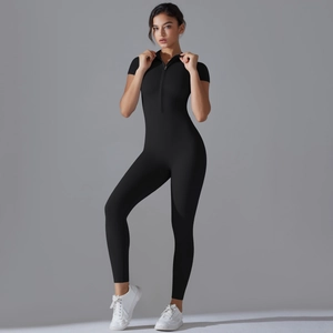 Detail of front zipper neckline on slim fit black short sleeve yoga sports jumpsuit