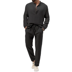 Detail of black men's casual long sleeve shirt and pants set in textured crepe fabric