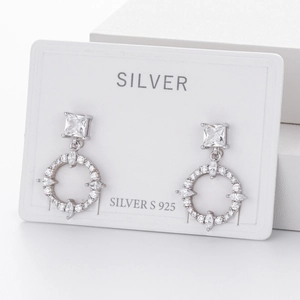 Detail of 925 sterling silver earrings with square cubic zirconia and circular drop