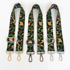 Adjustable leopard print nylon bag straps with gold, gunmetal, and silver metal hooks