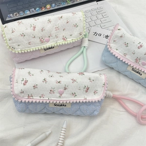 Floral pencil case with heart button and braided carry strap in three macaron colors