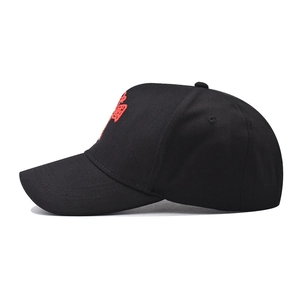 Detailed view of high-density Chinese lion embroidery on a black cotton baseball cap