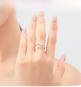 Detail shot of a polished 925 sterling silver leaf ring with micro-set zircon stones