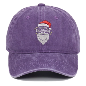 Detail of Santa embroidery and Merry Christmas text on purple washed cotton baseball cap