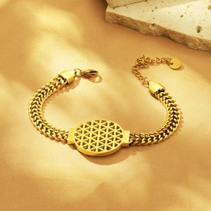 Macro shot of 18K gold plated wheat chain bracelet with hollow flower of life pendant